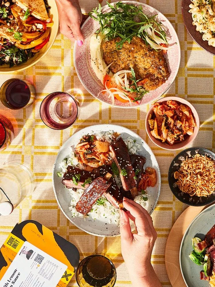 plates full of cookunity prepared meals on a stylized table