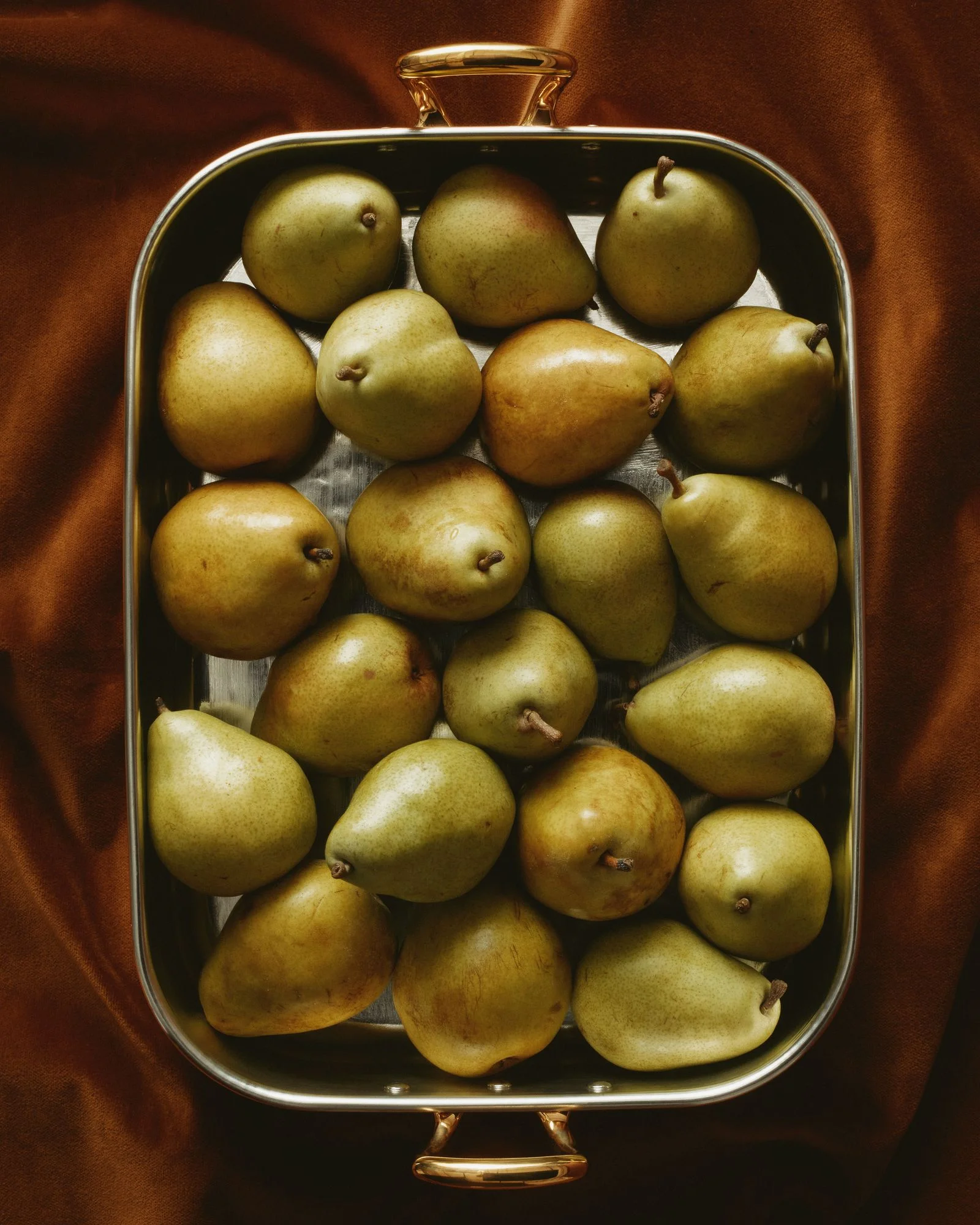 A Ruffoni copperbond baking dish with pears.