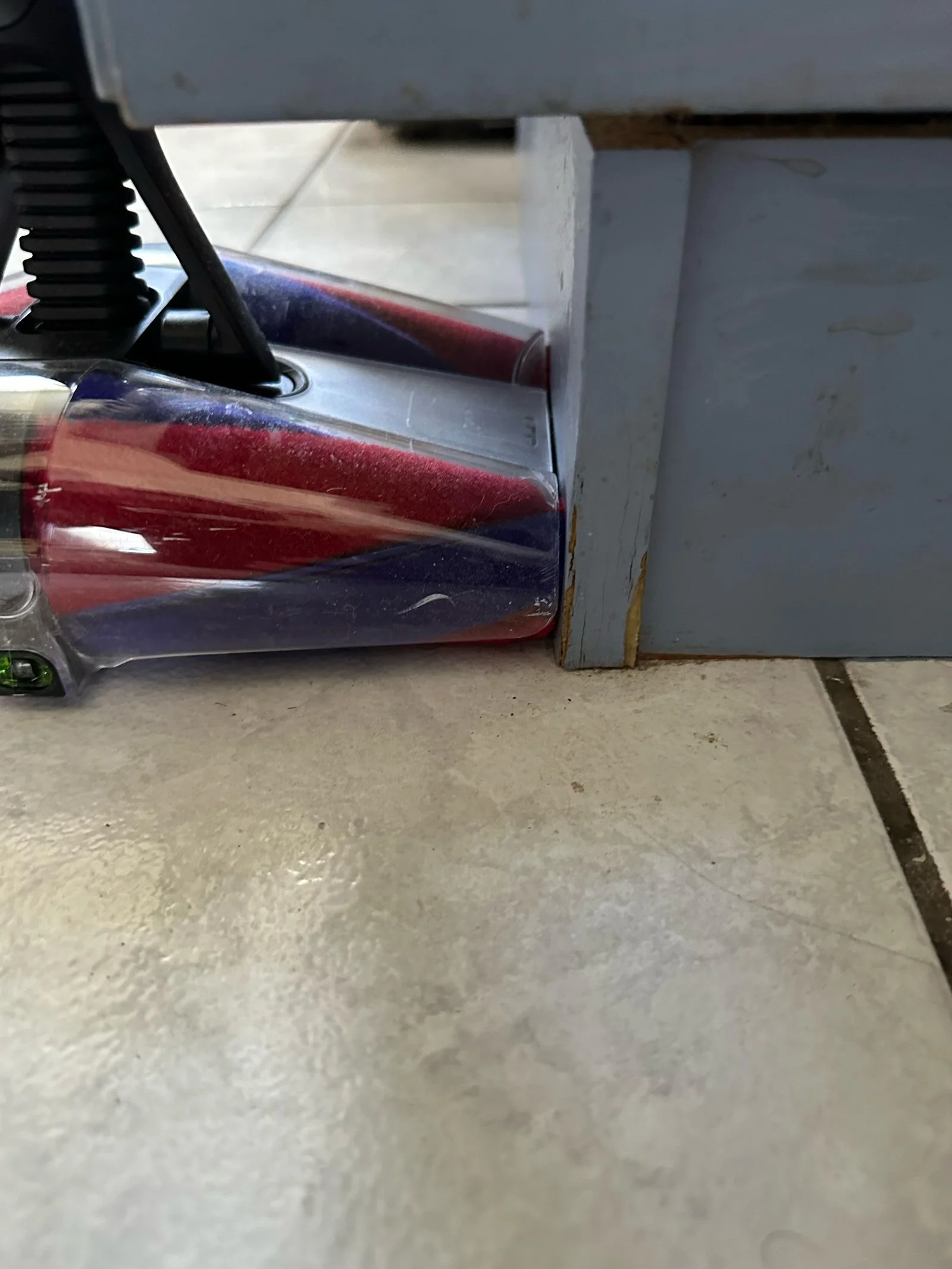 Dyson pencilvac flush against a wall