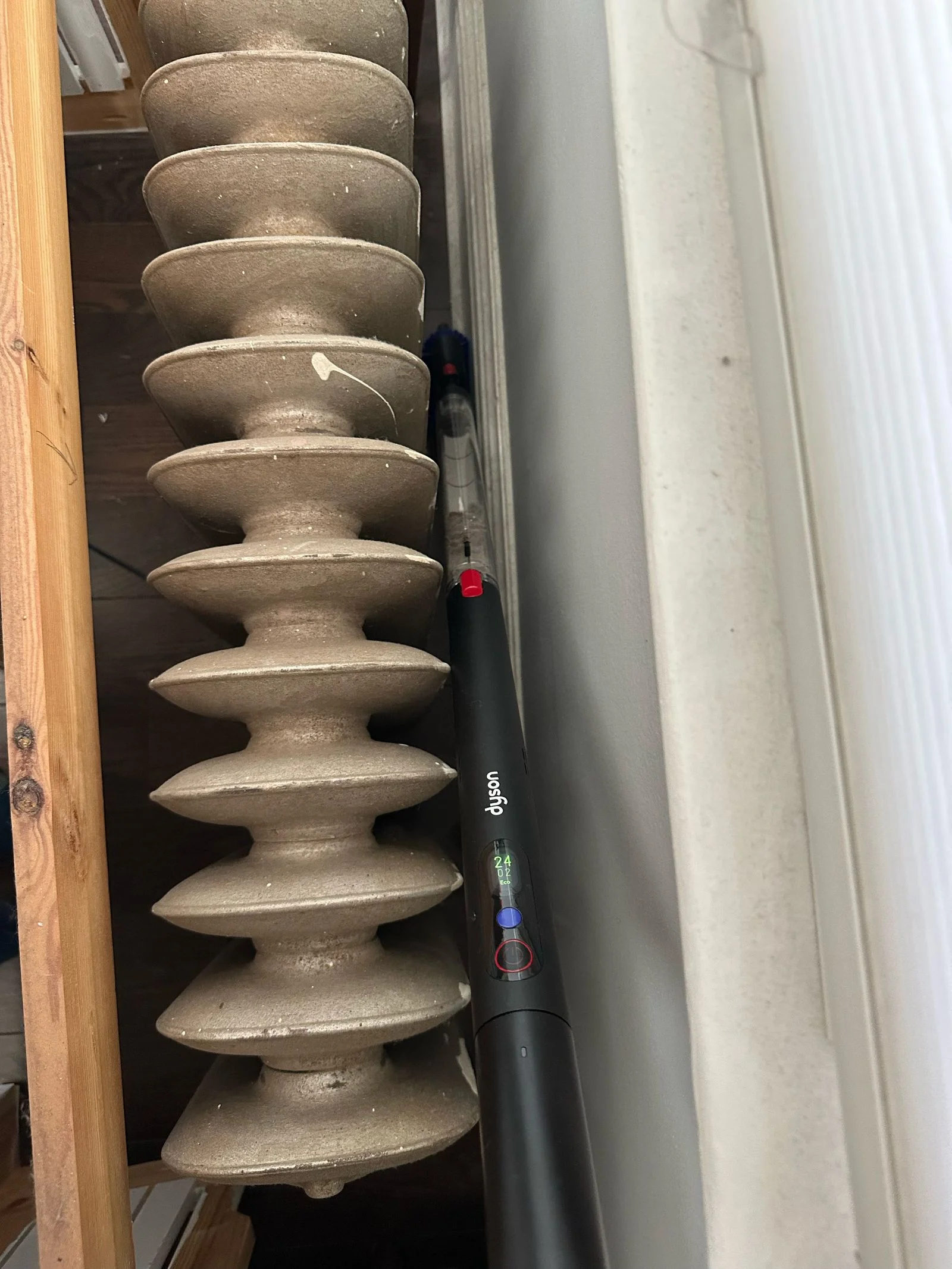 Dyson pencil vac sliding between radiator and wall
