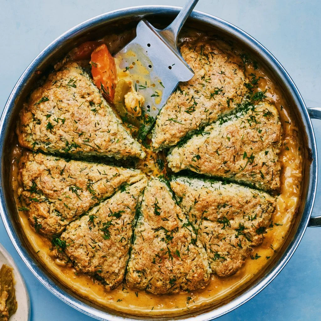 A top down view of chicken biscuits plated in a pan