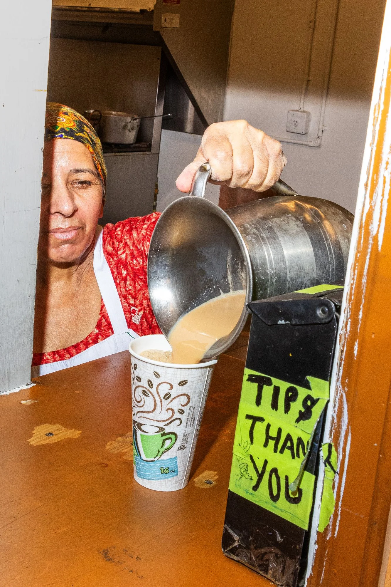 Image may contain Adult Person Cooking Food Pouring Food Stirring Food Face and Head