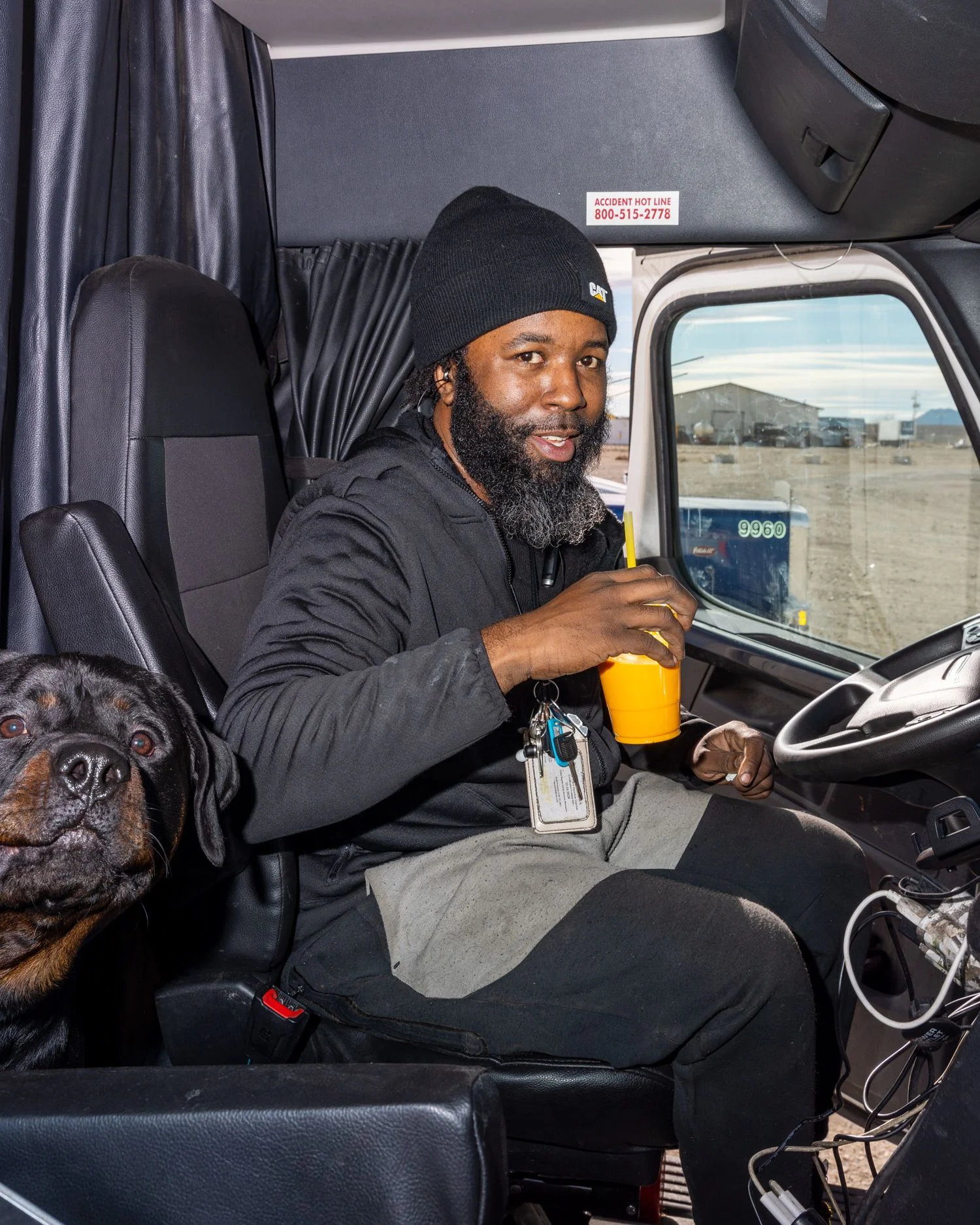 Image may contain Person Sitting Adult Face Head Animal Canine Dog Mammal Pet Photography and Portrait