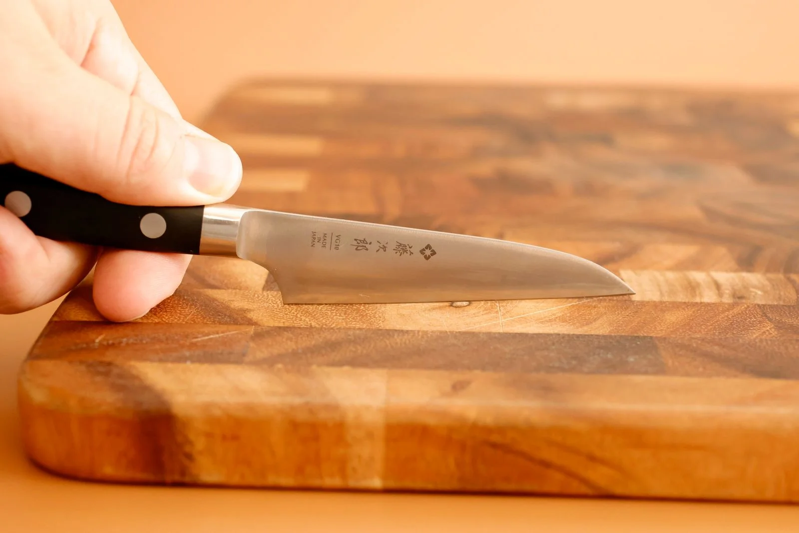 Image may contain Blade Weapon Knife Chopping Board Food Baby and Person