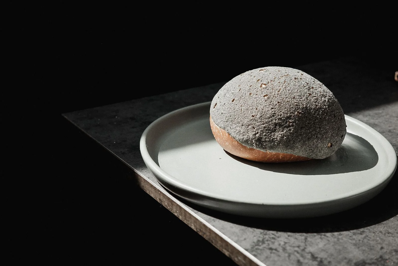 A concha from Vato in Brooklyn with yuzu curd totomoxtle and craquelin.